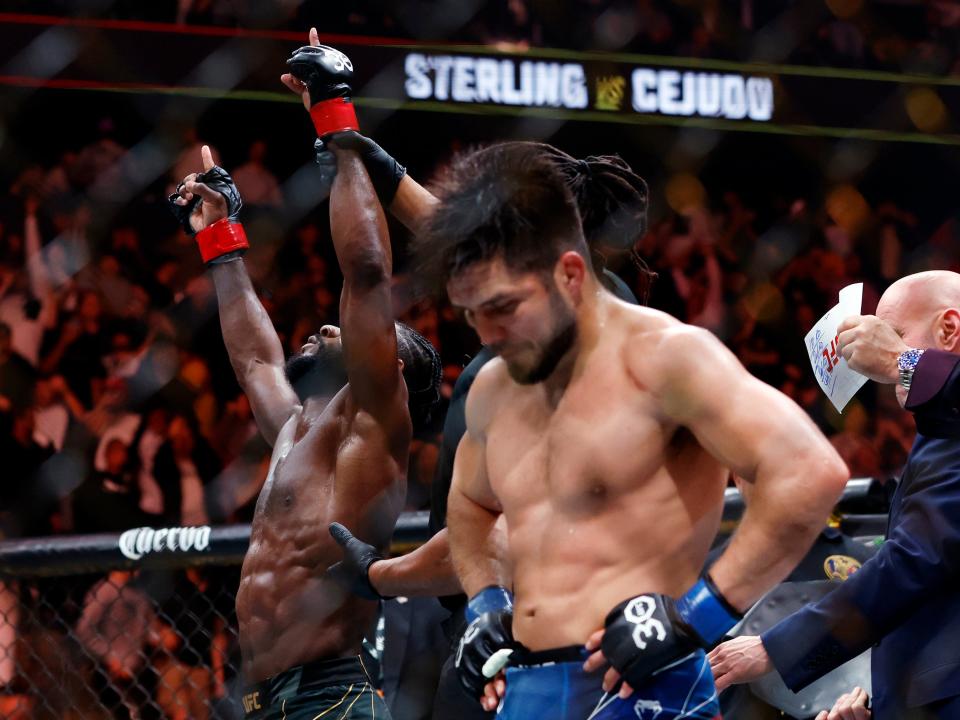 Henry Cejudo (right) reacts to his split-decision loss to Aljamain Sterling (Getty Images)