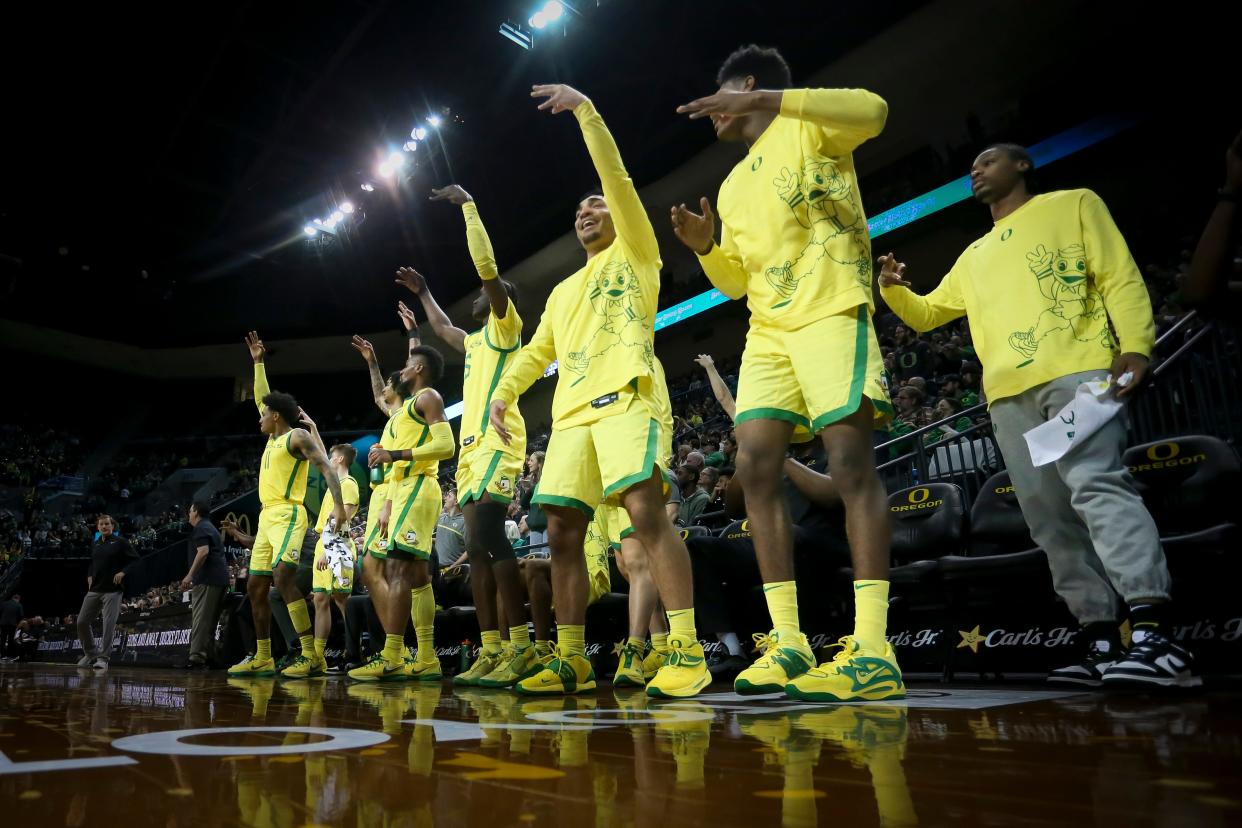 The Oregon bench celebrates a three-pointer as the Oregon Ducks host the Arizona Wildcats  Jan. 14.