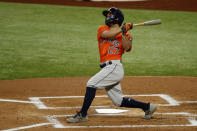 Houston Astros Jose Altuve watches a ball hit for a home run in the first inning of a baseball game against the Texas Rangers in Arlington, Texas, Sunday, Sept. 27, 2020. (AP Photo/Roger Steinman)