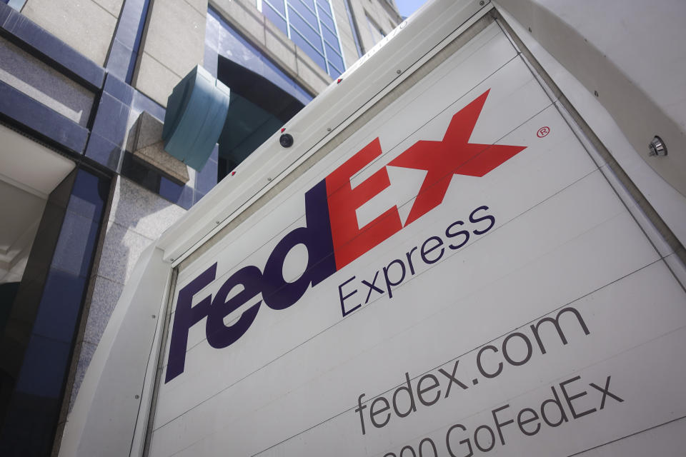 A FedEx delivery truck parks on the street, Tuesday, June 25, 2019, in downtown Cincinnati. (AP Photo/John Minchillo)