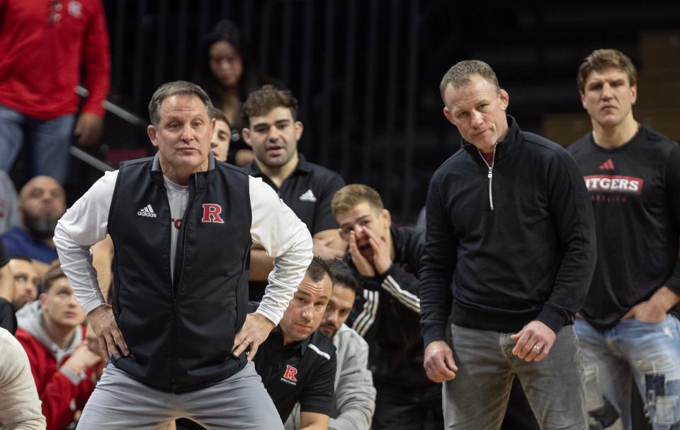 Rutgers University head wrestling coach Scott Goodale (left) responded to critics of his program Friday night at the NCAA Tournament in Kansas City.