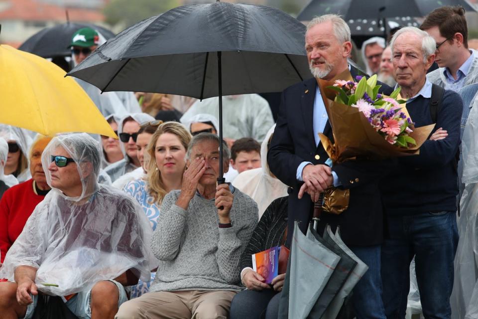 Family and community members stand for a moment of silence during the Bali Bombing Commemoration Ceremony at Dolphins Point, Coogee Beach (Getty Images)