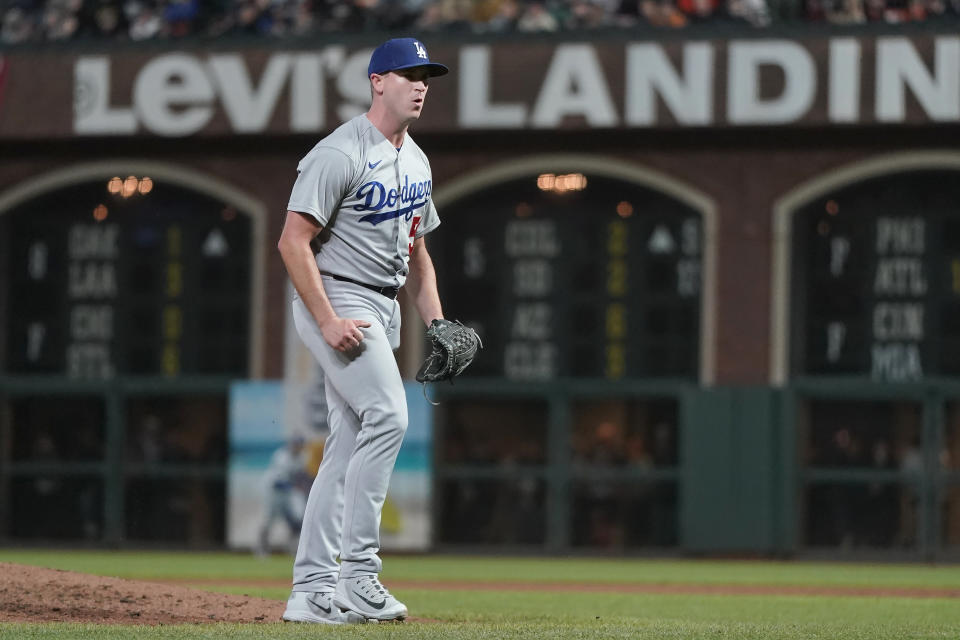 Los Angeles Dodgers pitcher Evan Phillips reacts after striking out San Francisco Giants' Austin Slater to retire the Giants during the sixth inning of a baseball game in San Francisco, Tuesday, Aug. 2, 2022. (AP Photo/Jeff Chiu)