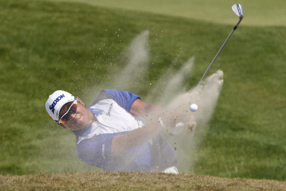 Hideki Matsuyama, of Japan, hits out of a bunker on the seventh hole during the third round at the PGA Championship golf tournament on the Ocean Course, Saturday, May 22, 2021, in Kiawah Island, S.C. (AP Photo/David J. Phillip)