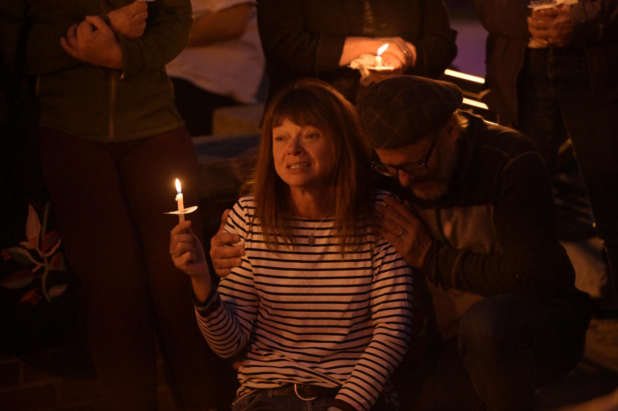 IDAHO SPRING, CO - SEPTEMBER 20 : Sally Glass, mother of Christian Glass, left, is comforted during a candlelight vigil for Christian held at Citizens Park in Idaho Springs, Colorado on Tuesday, September 20, 2022. A Clear Creek County deputy shot and killed 22-year-old Christian Glass on June 11 after Glass called 911 for help after crashing his car into a berm. (Photo by Hyoung Chang/The Denver Post)