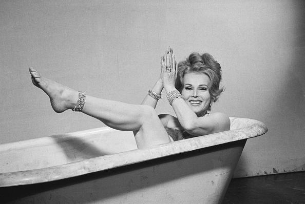 Zsa Zsa Gabor Seated In Bathtub Wearing Jewels