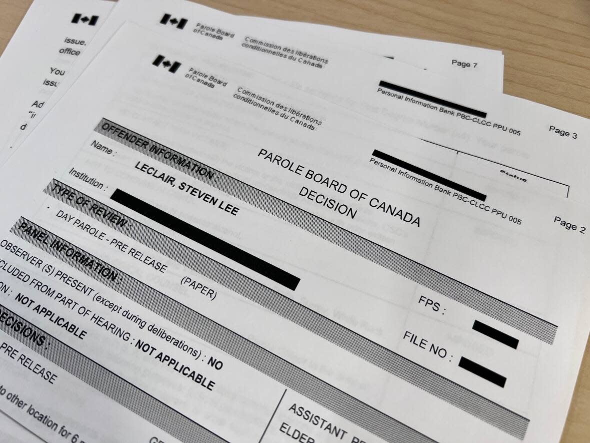 Parole Board of Canada documents pertaining to Steven Lee Leclair are pictured on Wednesday. Leclair was granted day parole in December 2022 after he was jailed for killing four people in 1980. (CBC News - image credit)