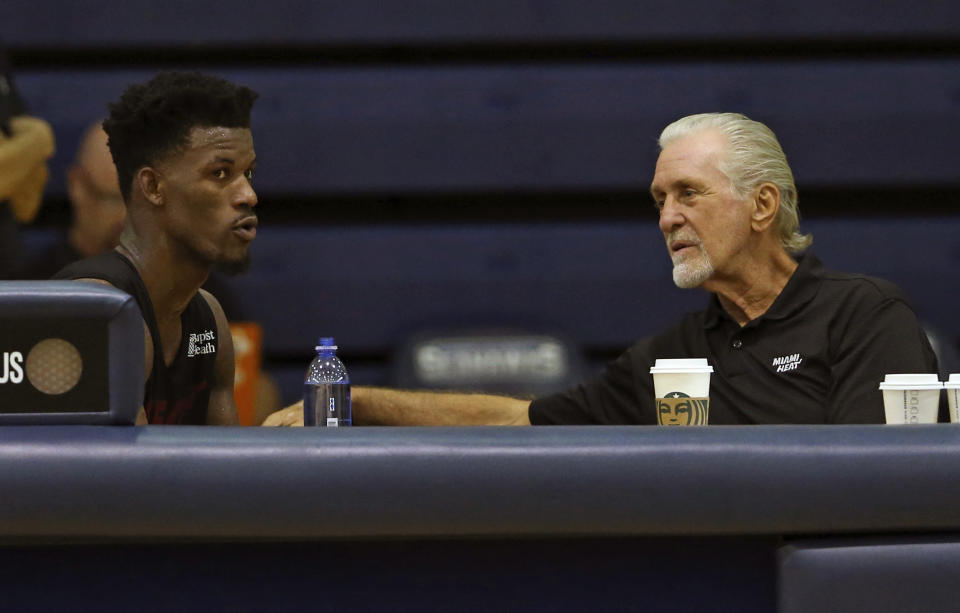 Miami Heat Heat President Pat Riley, right, talks with Heat forward Jimmy Butler during NBA basketball practice, Wednesday, Oct. 2, 2019 in West Palm Beach, Fla. (David Santiago/Miami Herald via AP)