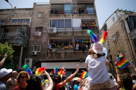 Revellers take part in a gay pride parade in Tel Aviv, Israel June 8, 2018. REUTERS/Corinna Kern