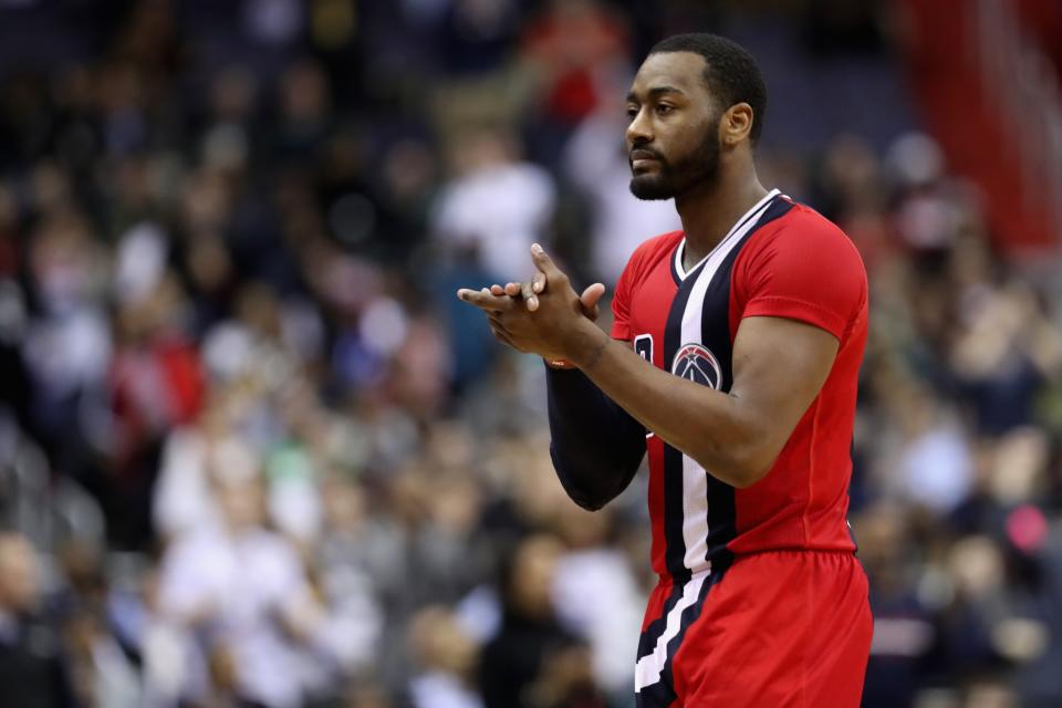 John Wall gives himself a hand. He's earned it. (Getty Images)