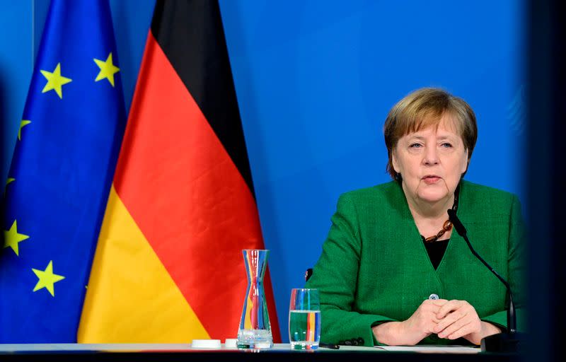 FILE PHOTO: German Chancellor Angela Merkel attends a video-conferenced meeting with representatives of the German Association of Local Utilities of municipally determined infrastructure undertakings and economic enterprises in Berlin