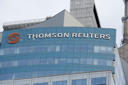 The Thomson Reuters logo is seen on the company building in Times Square, New York, U.S., January 30, 2018. REUTERS/Andrew Kelly