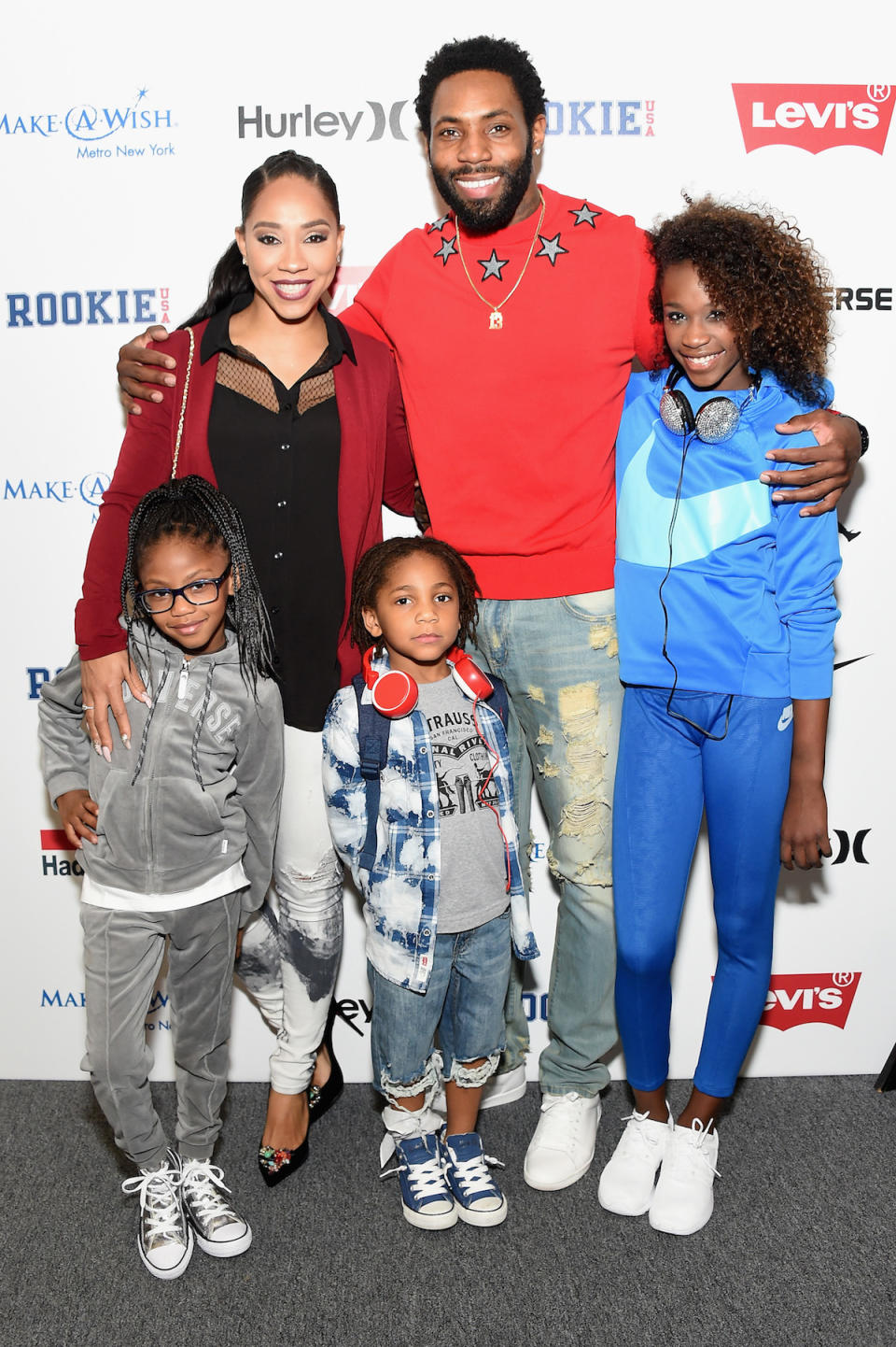 Terricka and Antonio Cromartie with three of their children. (Photo: Michael Loccisano/Getty Images for New York Fashion Week: The Shows)