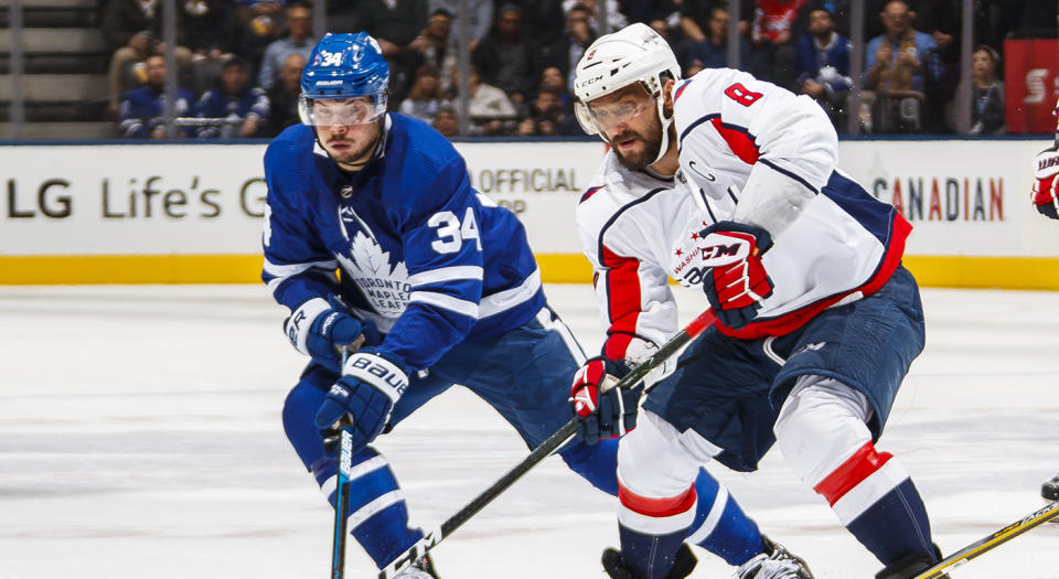 TORONTO, ON - FEBRUARY 21: Alex Ovechkin #8 of the Washington Capitals battles with Auston Matthews #34 and Jake Gardiner #51 of the Toronto Maple Leafs during the second period at the Scotiabank Arena on February 21, 2019 in Toronto, Ontario, Canada. (Photo by Mark Blinch/NHLI via Getty Images)