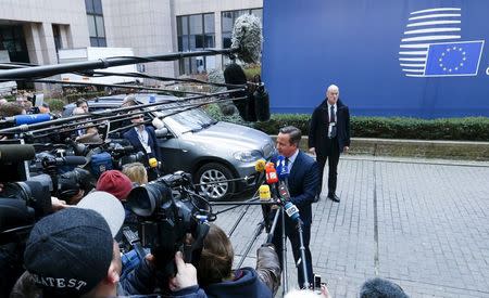 British Prime Minister David Cameron speaks to the media as he arrives at a European Union leaders summit addressing the talks about the so-called Brexit and the migrants crisis in Brussels, Belgium, February 18, 2016. REUTERS/Yves Herman