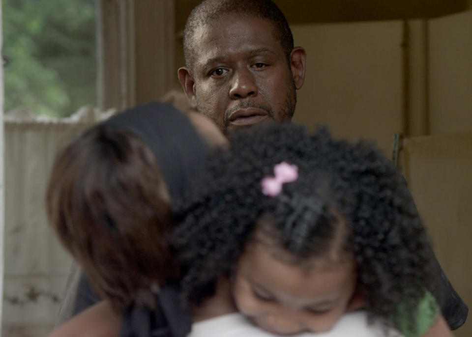 This photo provided by Codeblack Films shows Forest Whitaker, rear, as Angel, Nicole Ari Parker, left, as Sophie, and Ariana Neal as Francesca Sanchez, in a scene from the film, "Repentance." He plays the role of the bipolar Angel Sanchez, who seeks private treatment from a spiritual adviser before taking him hostage in the basement of the home where he and his young daughter reside. Whitaker took on a new challenge to grow in the psychological thriller which releases Friday, Feb. 28, 2014. (AP Photo/Codeblack Films, Patti Perret)