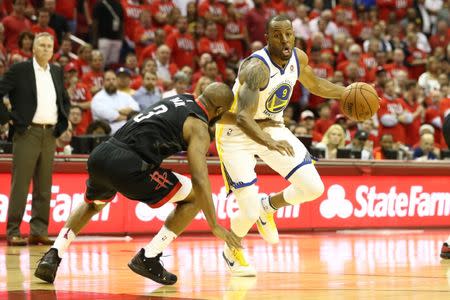 May 14, 2018; Houston, TX, USA; Golden State Warriors forward Andre Iguodala (9) drives against Houston Rockets guard Chris Paul (3) during the fourth quarter in game one of the Western conference finals of the 2018 NBA Playoffs at Toyota Center. Mandatory Credit: Troy Taormina-USA TODAY Sports
