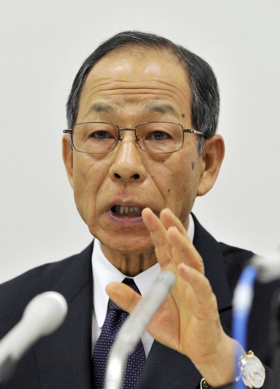 A file picture taken on October 14, 2011 shows Olympus president Tsuyoshi Kikukawa at a press conference at the Tokyo Stock Exchange. The Tokyo District Court handed Kikukawa a three-year suspended jail term for his role in a massive accounting fraud at the company