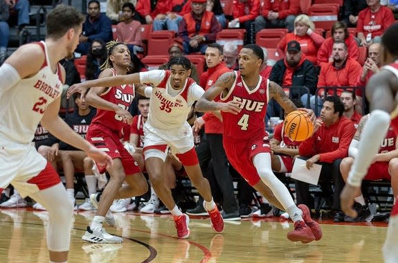 Bradley University forward Darius Hannah (35) chases guard Shamar Wright during the Braves 56-54 victory over Southern Illinois University-Edwardsville at First Community Arena on Tuesday, Dec. 6, 2022.