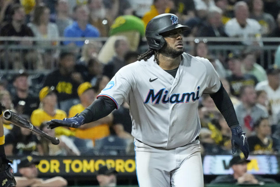 Miami Marlins' Josh Bell hits a sacrifice fly off Pittsburgh Pirates relief pitcher Dauri Moreta, driving in a run, during the sixth inning of a baseball game in Pittsburgh, Saturday, Sept. 30, 2023. (AP Photo/Gene J. Puskar)