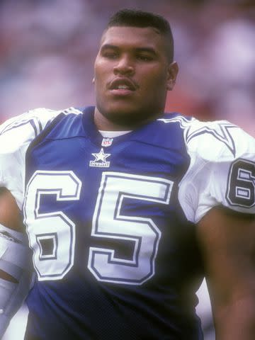 <p>Mitchell Layton/Getty</p> Ron Stone #65 of the Dallas Cowboys in 1995.