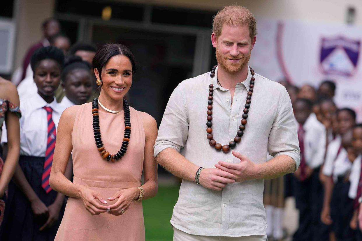 <p>AP Photo/Sunday Alamba</p> Meghan Markle and Prince Harry visit children at the Lights Academy in Abuja, Nigeria, Friday, May 10, 2024.