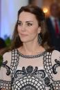 <p>The Duchess teamed the dress with statement chandelier earrings and nude lipstick. <i>[Photo: PA Images]</i></p>