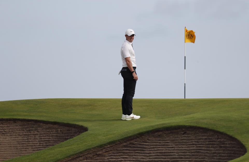 Northern Ireland's Rory McIlroy looks at the bunkers that in front of the 10th green during the first round British Open Golf Championship at Royal St George's golf course Sandwich, England, Thursday, July 15, 2021. (AP Photo/Peter Morrison)