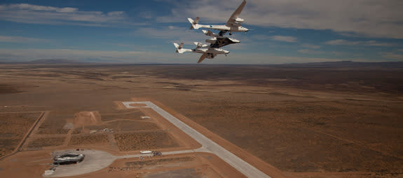 Virgin Galactic's high-flying WhiteKnightTwo mothership cradles SpaceShipTwo over New Mexico’s Spaceport America.