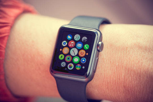 PRAGUE, CZECH REPUBLIC - June 22, 2015: Woman Using App on Apple Watch outside. Multiple Apps View.