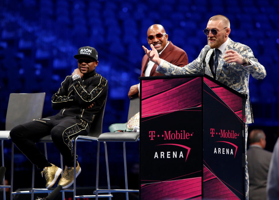 <p>UFC lightweight champion Conor McGregor of Ireland responds to a question during post-fight news conference with undefeated boxer Jr. (L) of the U.S. and Mayweather advisor Leonard Ellerbe at T-Mobile Arena in Las Vegas, Nevada, U.S. August 27, 2017. REUTERS/Steve Marcus </p>