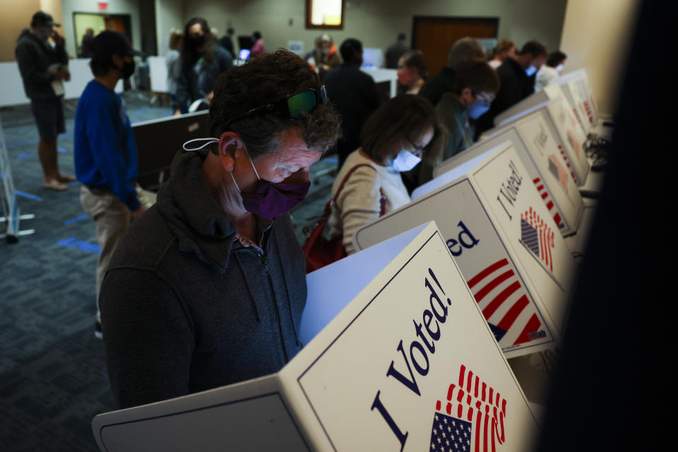 CHARLESTON, SC - OCTOBER 30: Robert Clair casts his in-person absentee ballot at the Charleston County Public Library on October 30, 2020 in Charleston, South Carolina. More than 1500 residents voted early at the library yesterday and the location hopes to serve more people today. (Photo by Michael Ciaglo/Getty Images)