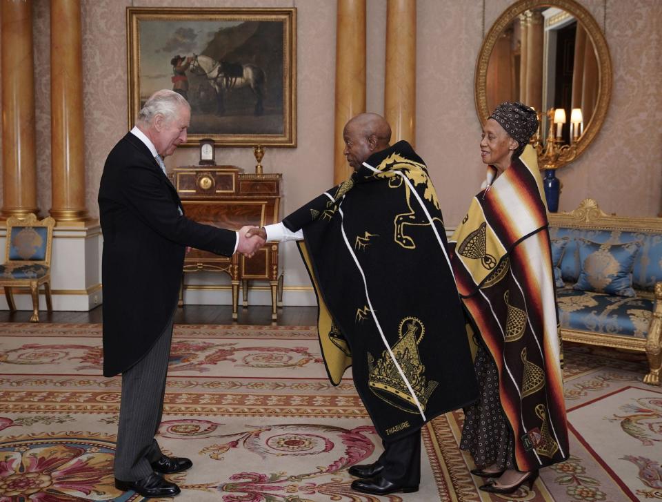King Charles III meets His Excellency Nehemia Sekhonyana Bereng, High Commissioner for the Kingdom of Lesotho and his wife Ntee Constance Bereng at Buckingham Palace on October 27, 2022.