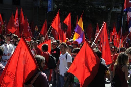 People take part in a demonstration in Madrid. Tens of thousands of chanting protesters from across Spain packed the centre of Madrid on Saturday for a rally against government austerity measures aimed at avoiding the need for a bailout