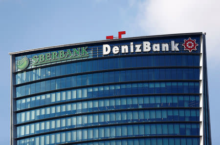 FILE PHOTO: Logos of Russia's Sberbank and Turkey's Denizbank are seen on the headquarters of Denizbank in Istanbul, Turkey January 27, 2016. REUTERS/Murad Sezer/File Photo