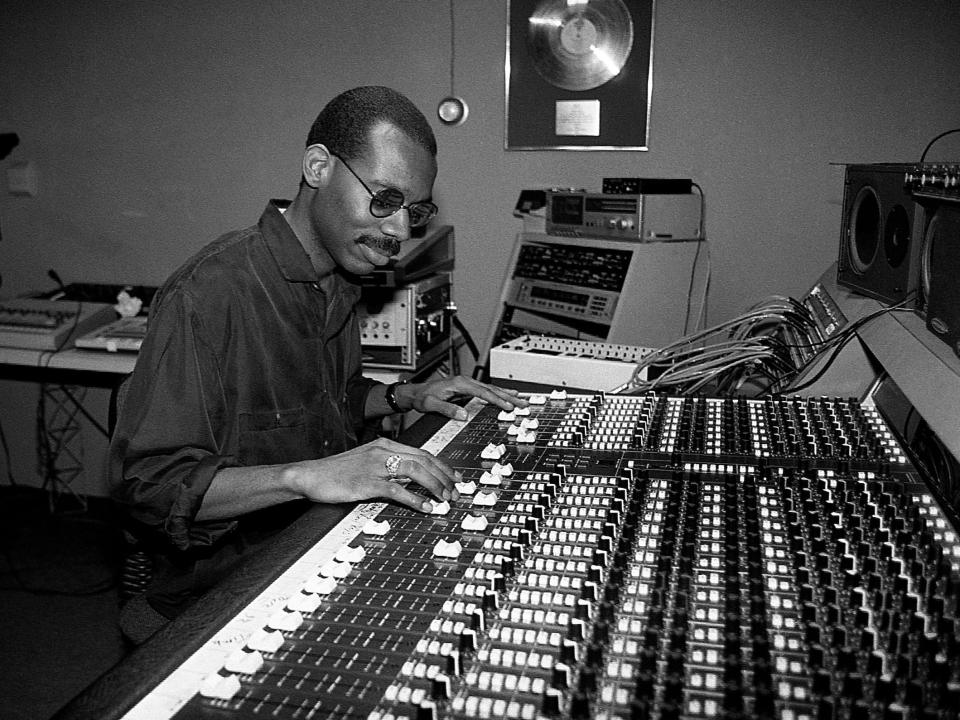 A photo of producer and dj Joe Smooth at a sound board.