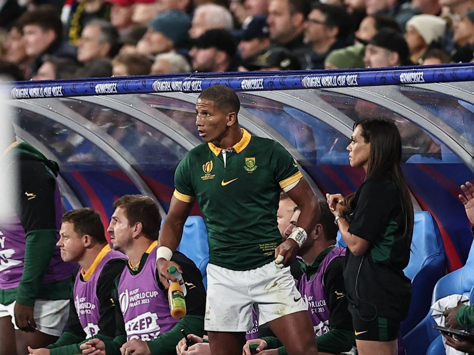 Libbok (C) is seen on the bench after he was substituted (AFP via Getty Images)