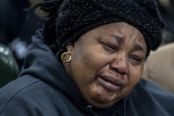 Patrick Lyoya's mother, Dorcas Lyoya, reacts during the funeral for her son Patrick Lyoya at the Renaissance Church of God in Christ Family Life Center in Grand Rapids, Mich. on Friday, April 22, 2022. The Rev. Al Sharpton demanded that authorities publicly identify the Michigan officer who killed Patrick Lyoya, a Black man and native of Congo who was fatally shot in the back of the head after a struggle, saying at Lyoya's funeral Friday: “We want his name!" (Cory Morse/The Grand Rapids Press via AP)