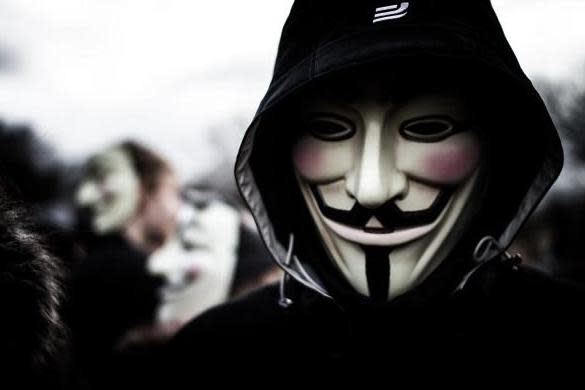 Anonymous members often wear Guy Fawkes masks in the style of the film and graphic novel V for Vendetta: Universal Images Group via Getty