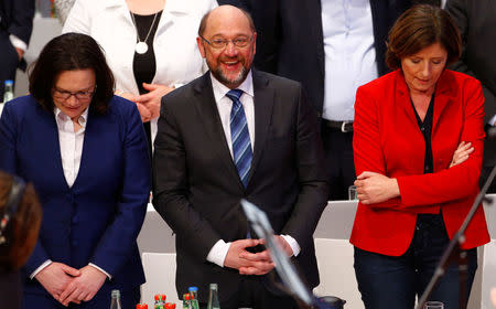 Germany's Social Democratic Party (SPD) leader Martin Schulz, SPD parliamentary group leader Andrea Nahles and Prime Minister of federal state Rhineland-Palatinate Malu Dreyer react after voting result during the SPD's one-day party congress in Bonn, Germany, January 21, 2018. REUTERS/Thilo Schmuelgen