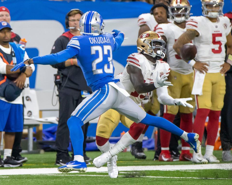 San Francisco 49ers receiver Deebo Samuel makes a catch in front of Detroit Lions cornerback Jeff Okudah in the third quarter and runs for a 79-yard touchdown at Ford Field, Sept. 12, 2021.