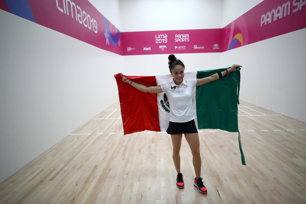 LIMA, PERU - AUGUST 07:  Paola Longoria of Mexico holds the Mexican flag after defeating María José Vargas of Argentina during their women's final racquetball match on Day 12 of Lima 2019 Pan American Games at Villa Deportiva Regional del Callao on August 07, 2019 in Lima, Peru. Longoria won the match for the gold medal.  (Photo by Ezra Shaw/Getty Images)