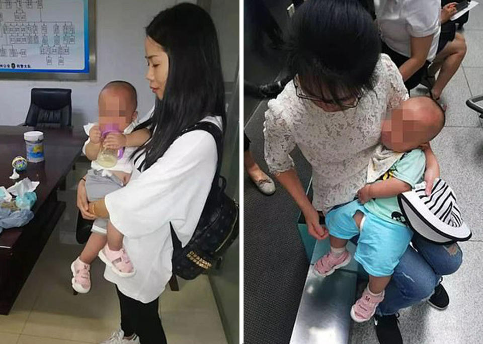 Rescue team members hold the twin boys who were reportedly trafficked by their mother. Source: Cixi police