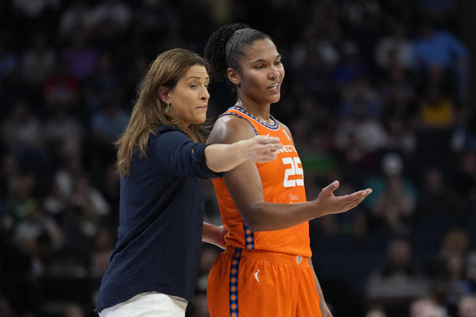 Connecticut Sun coach Stephanie White, left, talks with forward Alyssa Thomas during the first half of Game 3 of the team's WNBA first-round basketball playoff series against the Minnesota Lynx, Wednesday, Sept. 20, 2023, in Minneapolis. (AP Photo/Abbie Parr)