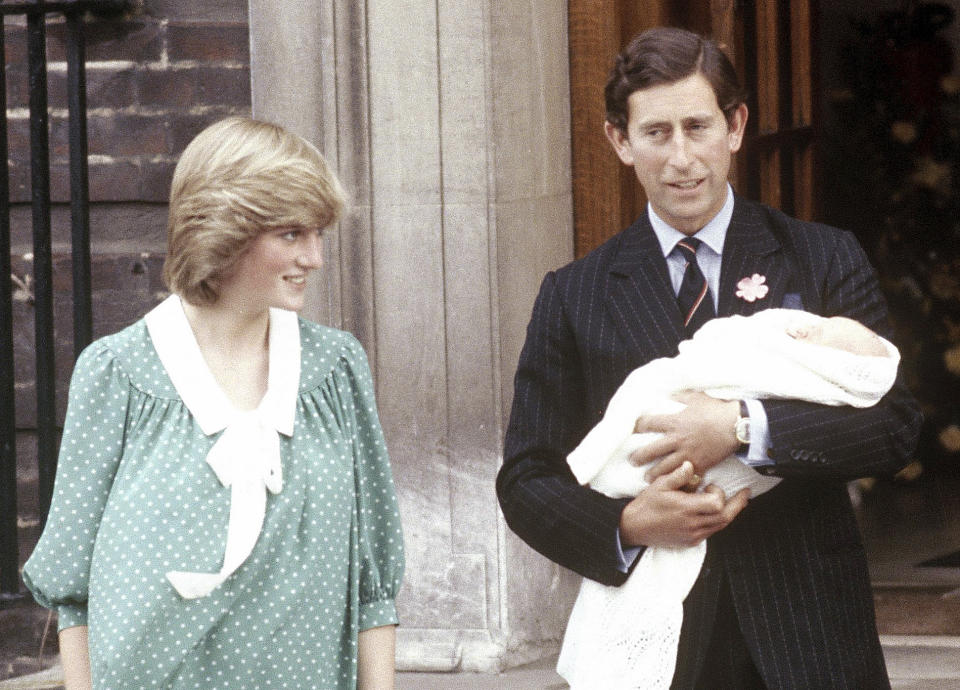 FILE - In this June 22, 1982 file photo Britain's Prince Charles, Prince of Wales, poses with his wife Princess Diana and their newborn son Prince William, as they leave St. Mary's Hospital, Paddington, London. Prince Charles is readying the paperwork to claim his pension when he turns 65 on Thursday, Nov. 14, 2013, but he still hasn't started the job he was born to do. (AP Photo/John Redman, File)