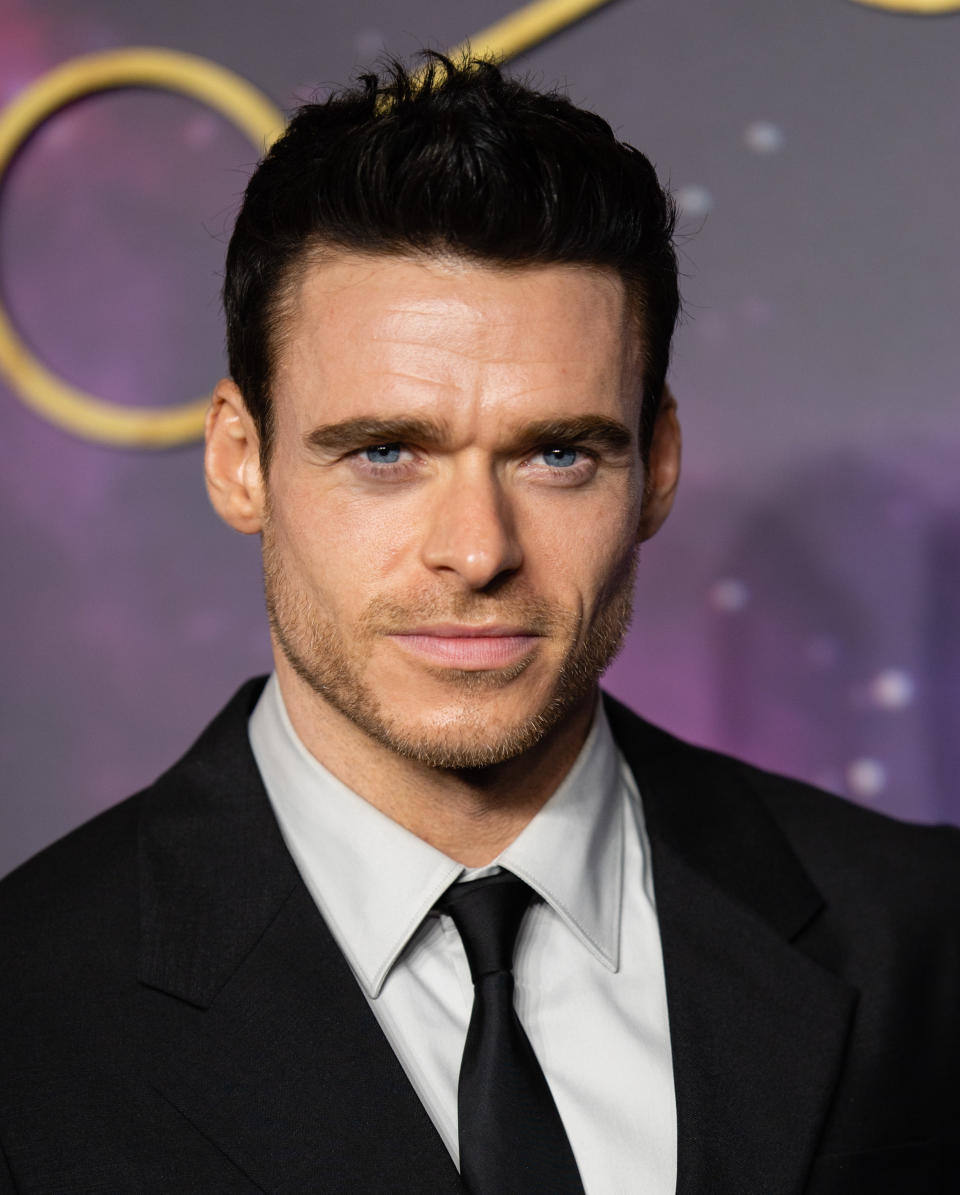 Richard Madden looks into the camera.