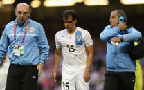 CARDIFF, WALES - AUGUST 01: Diego Rodriguez of Uruguay walks off with an injury to his head during the Men's Football first round Group A match between Great Britain and Uruguay on Day 5 of the London 2012 Olympic Games at Millennium Stadium on August 1, 2012 in Cardiff, Wales. (Photo by Julian Finney/Getty Images)