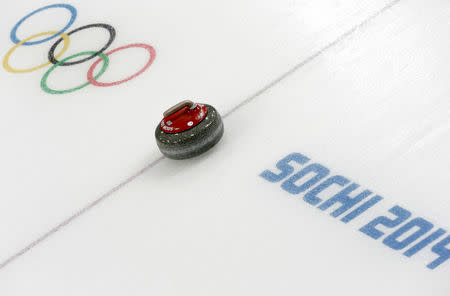 FILE PHOTO: A stone is seen during a women's curling round robin game at the 2014 Sochi Winter Olympics at the Ice Cube Curling Center February 17, 2014. REUTERS/Ints Kalnins/File photo