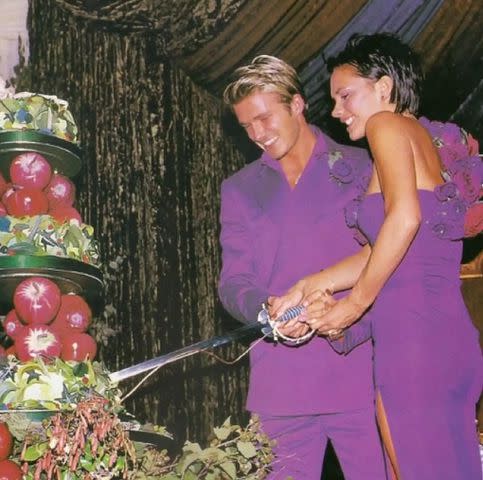 <p>Victoria Beckham/Instagram</p> David and Victoria Beckham wear coordinating purple looks at their wedding reception.