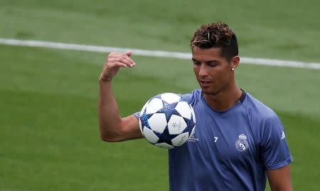 Football Soccer - Real Madrid training session - UEFA Champions League Final - Valdebebas Soccer Grounds, Madrid, Spain - 30/5/17 - Real Madrid's Cristiano Ronaldo looks at the ball during the training session at open media day. REUTERS/Sergio Perez